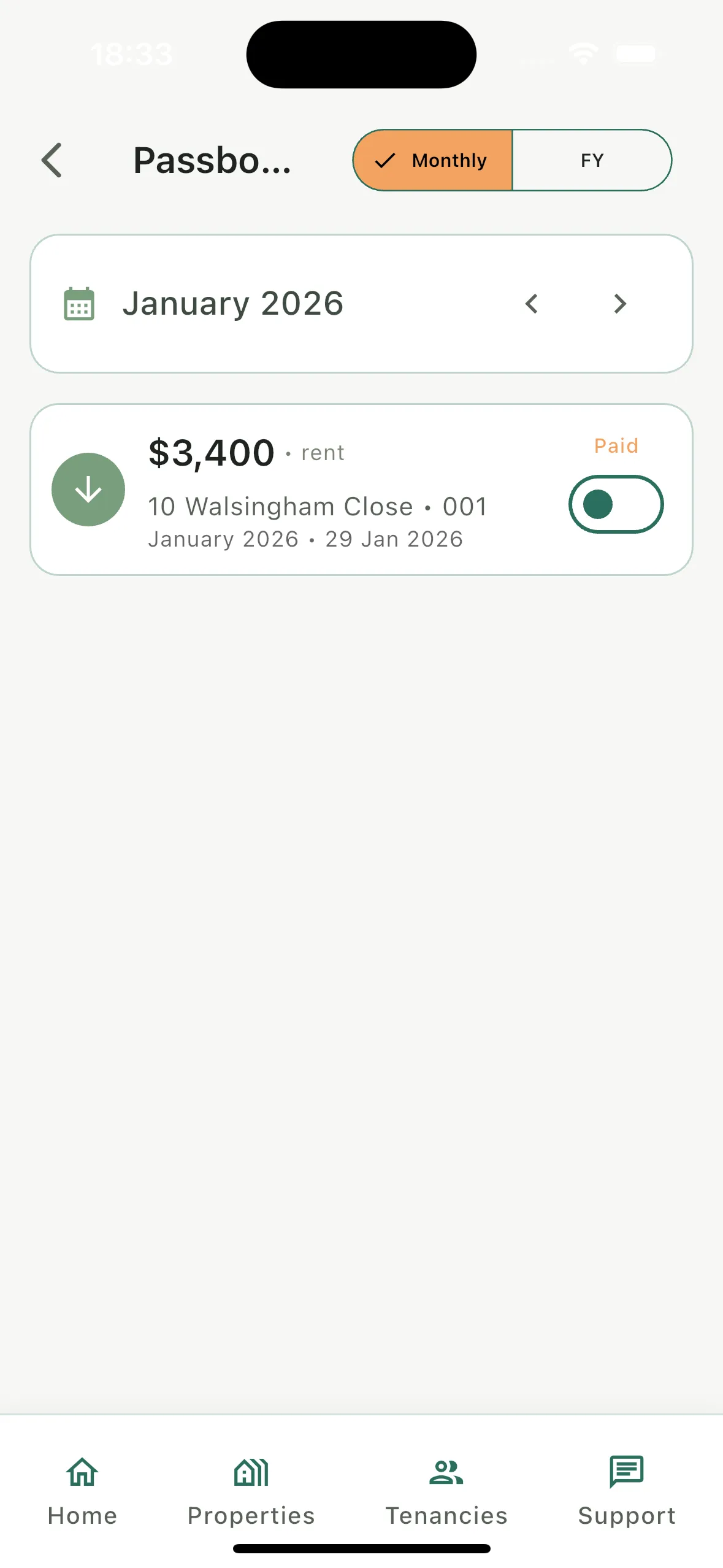 Rhentto passbook showing a rent payment by month with a monthly and financial year toggle